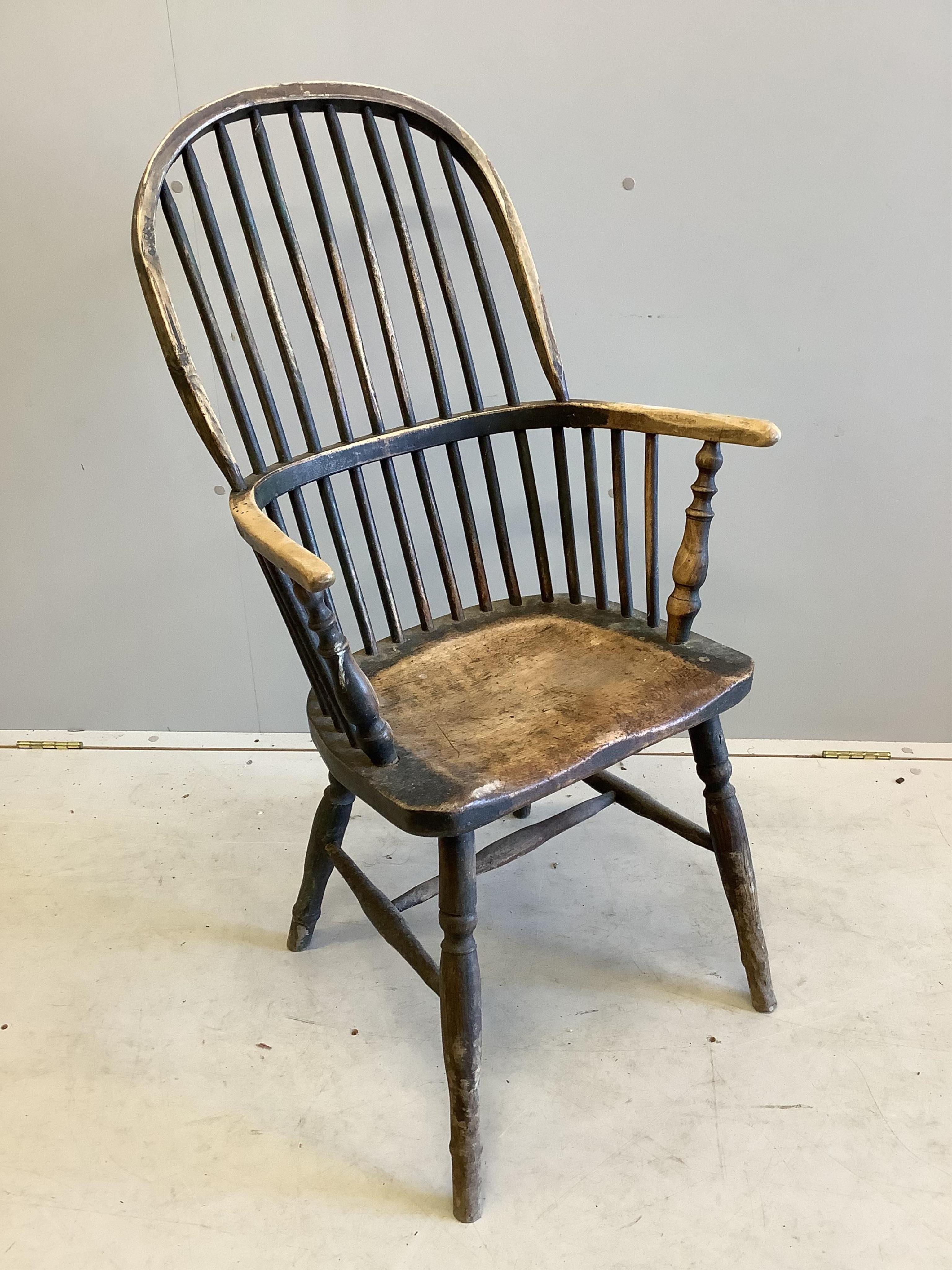 A 19th century elm and beech Windsor comb back armchair, width 58cm, depth 36cm, height 100cm